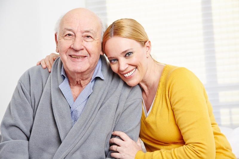 Image of a elderly man with a caregiver